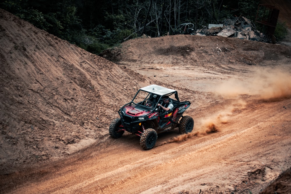 black and gray jeep wrangler on brown dirt road during daytime