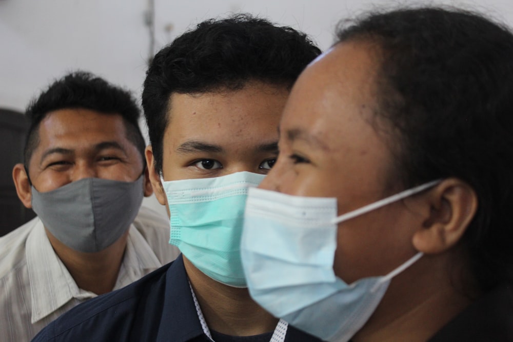 man in black shirt wearing white mask