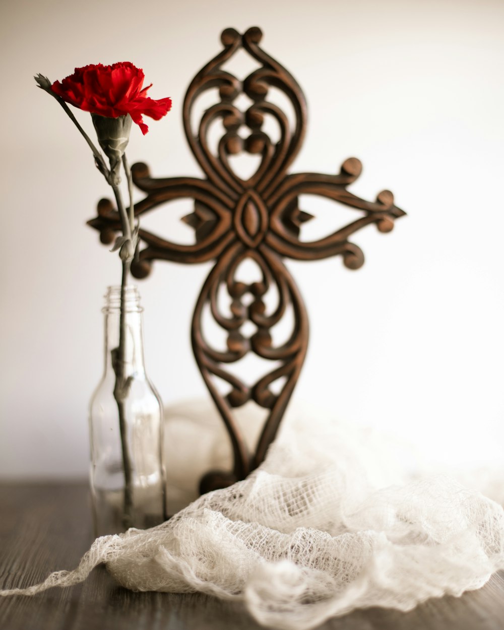 red rose in clear glass vase