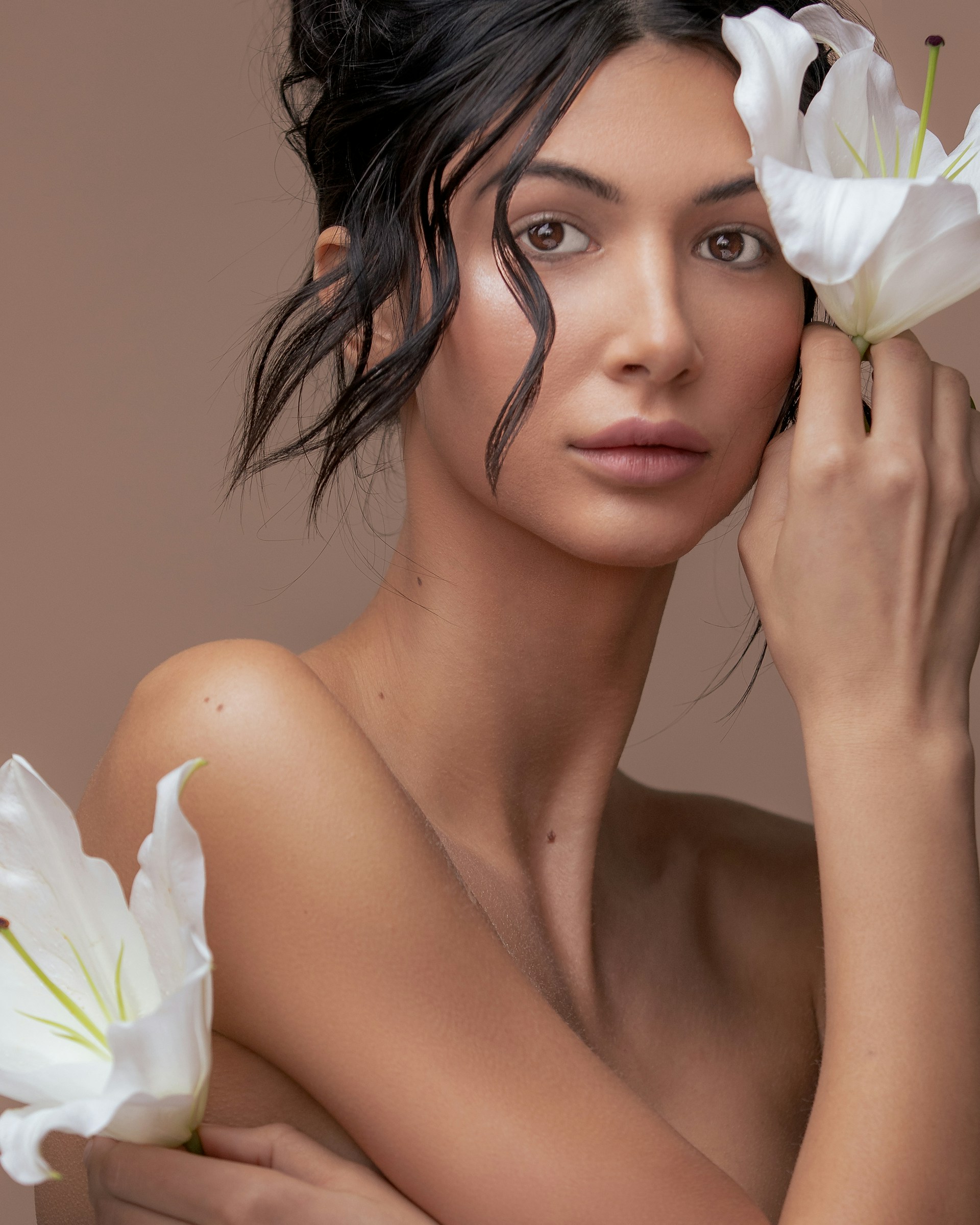 woman with white flower on her ear