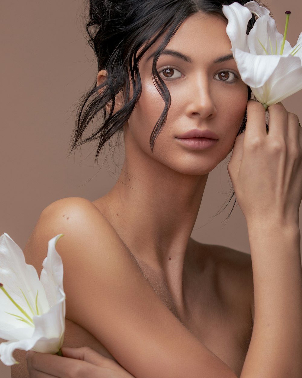 woman with white flower on her ear