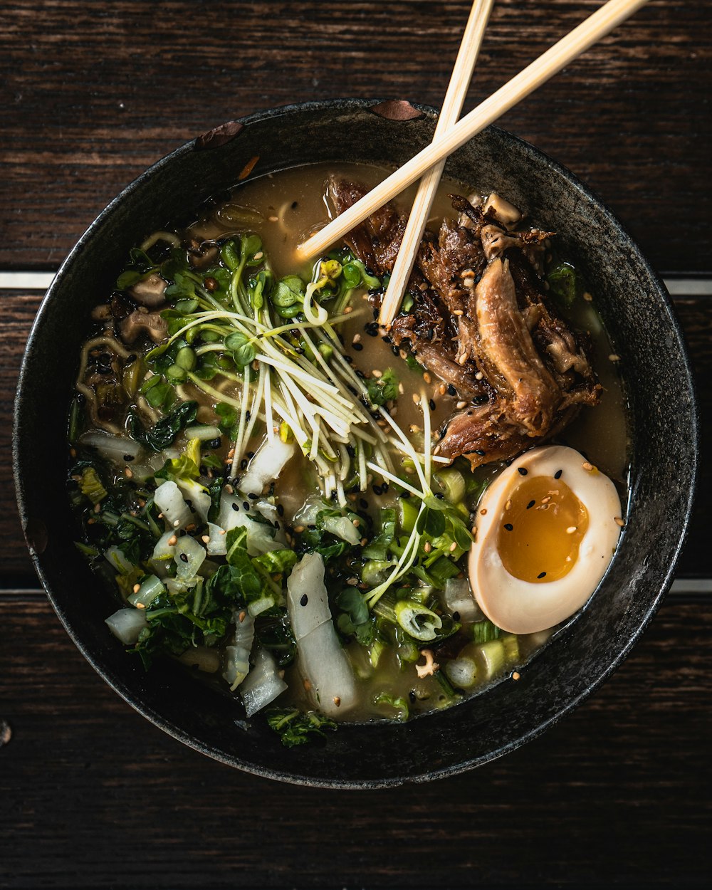 cooked food on black ceramic bowl