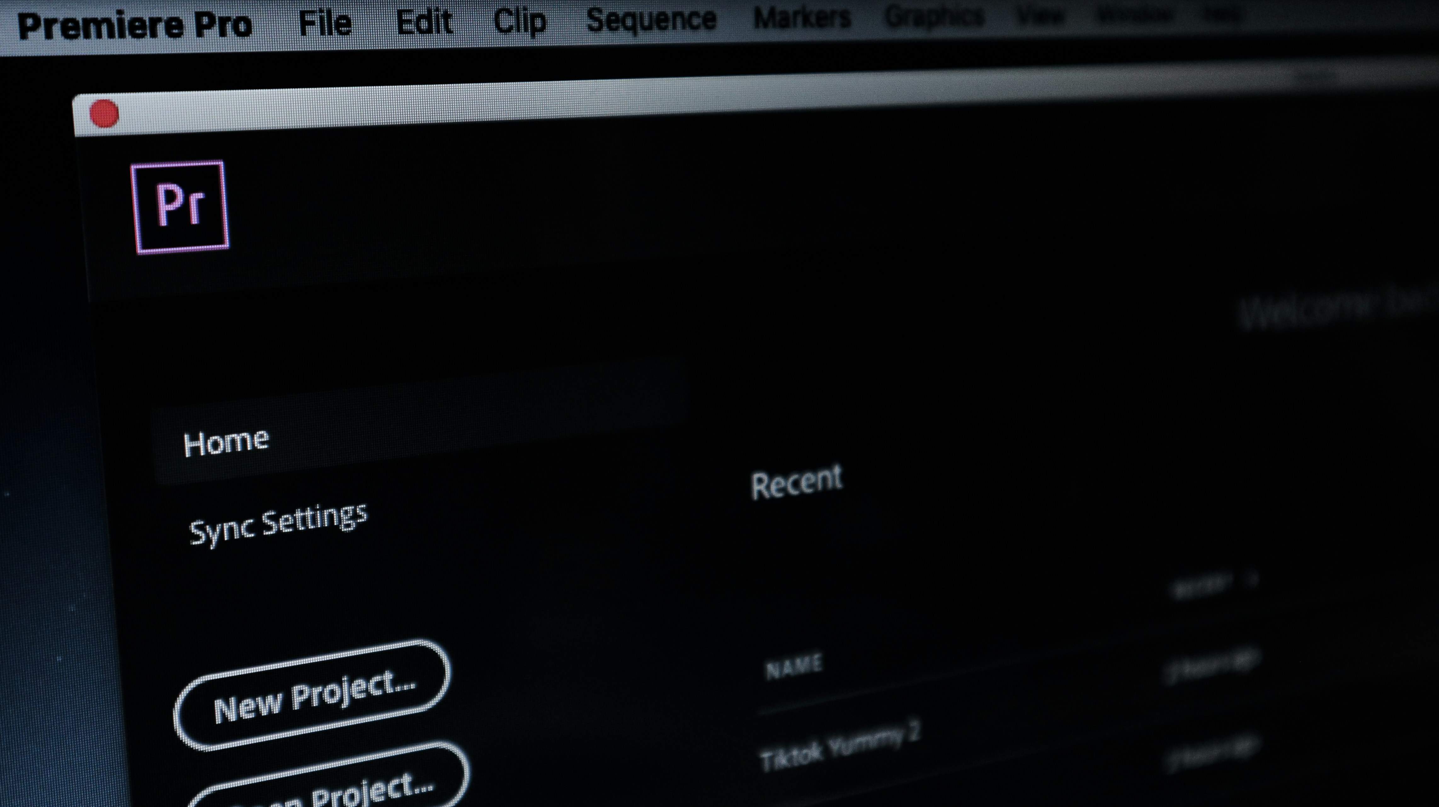 a computer screen with a red button on it