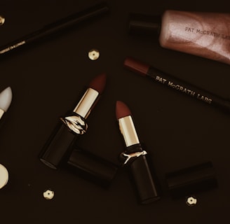 red lipstick on black surface