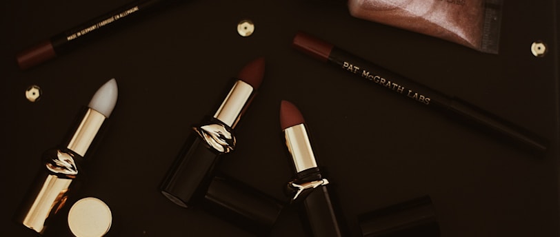 red lipstick on black surface