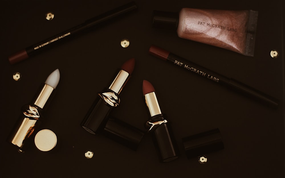 red lipstick on black surface