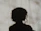 silhouette of person standing near white textile