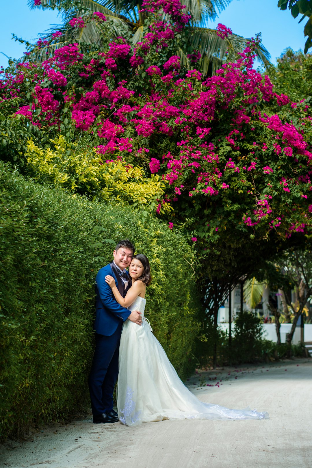 woman in white wedding gown beside woman in blue long sleeve dress