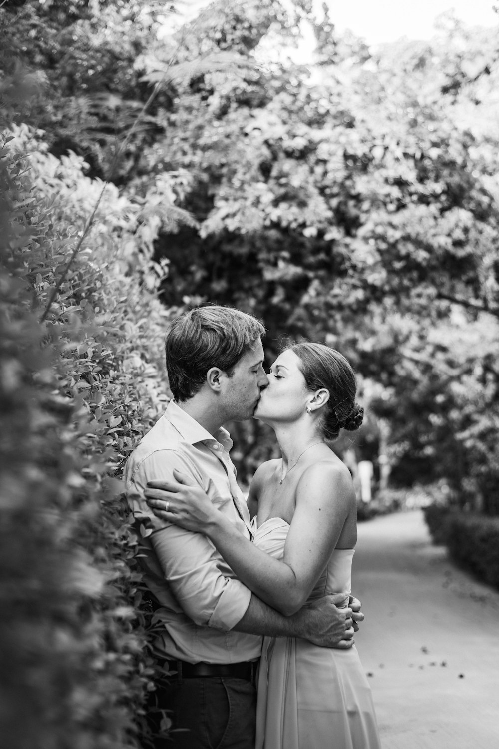 grayscale photo of couple kissing