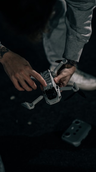 person holding gray and black toy gun