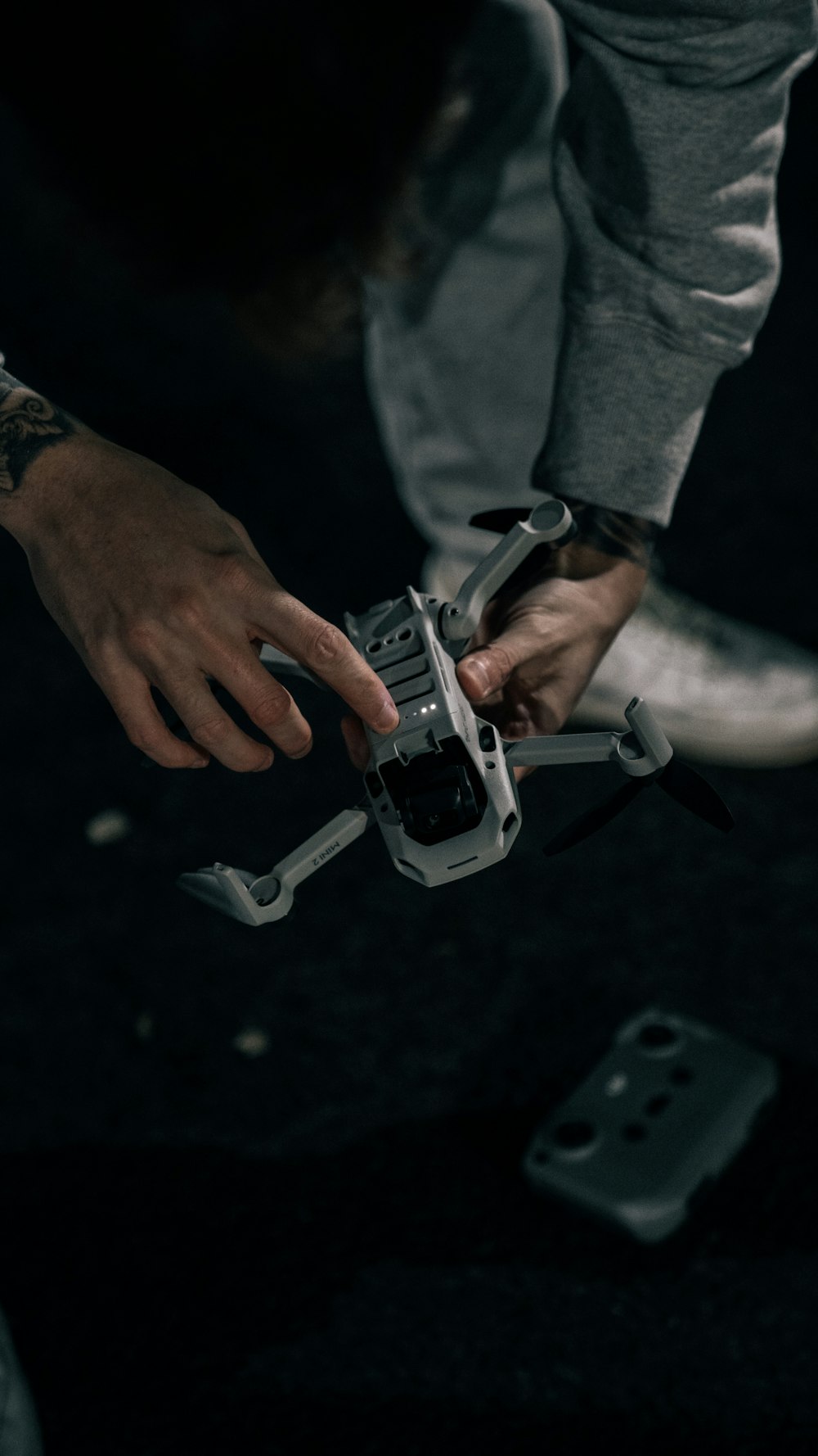 person holding gray and black toy gun