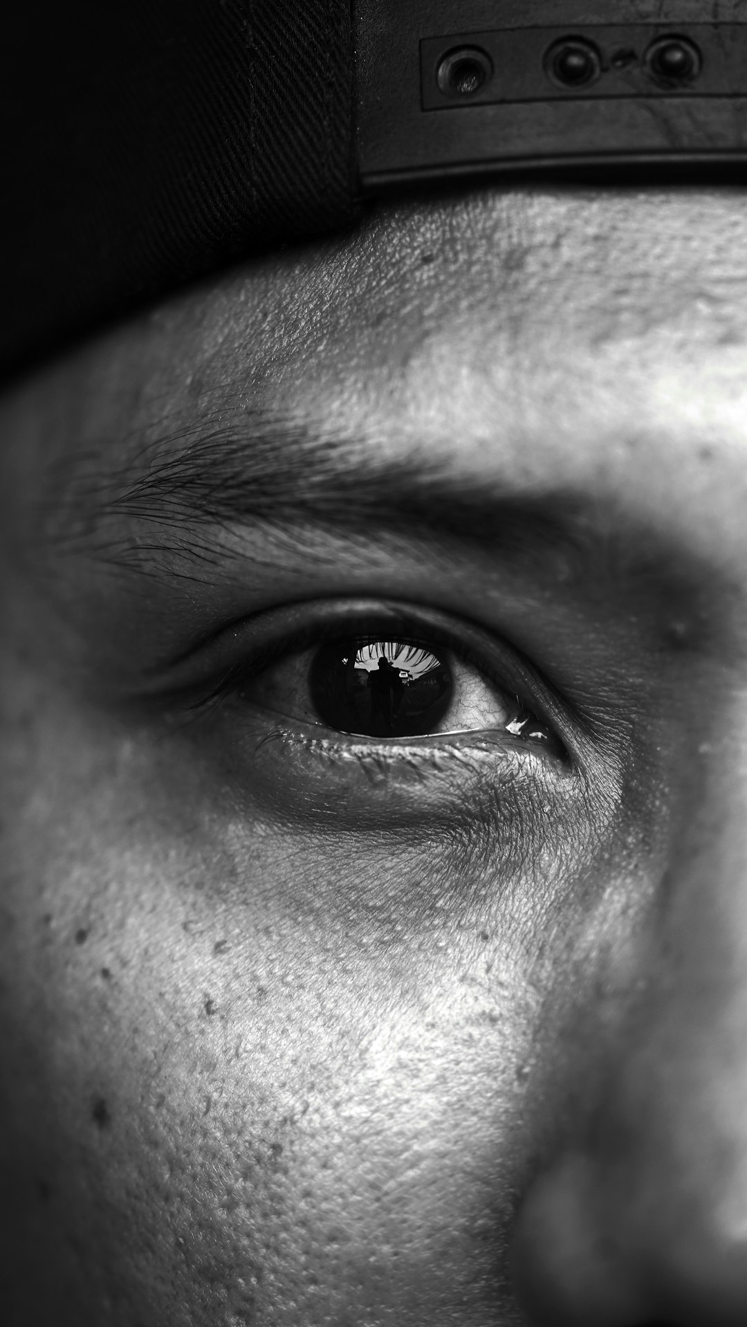 grayscale photo of persons eye