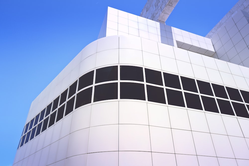 white and black concrete building under blue sky during daytime