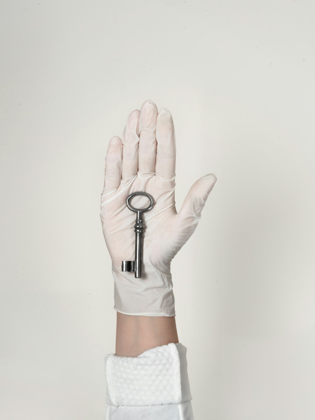  person wearing white shorts with black bracelet key