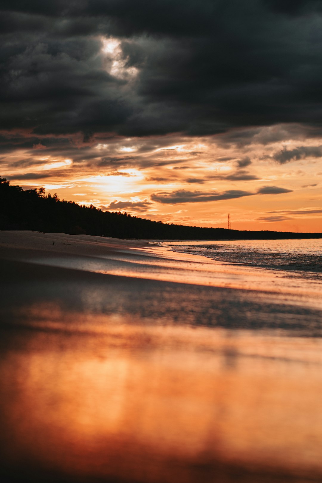 body of water during sunset