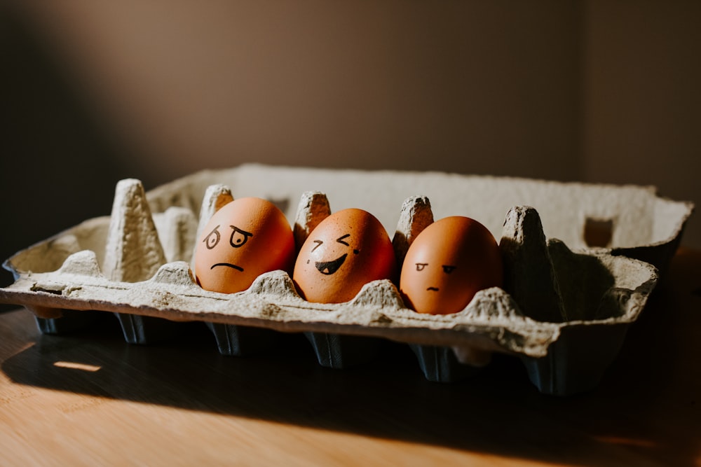 orange and white eggs on white tray