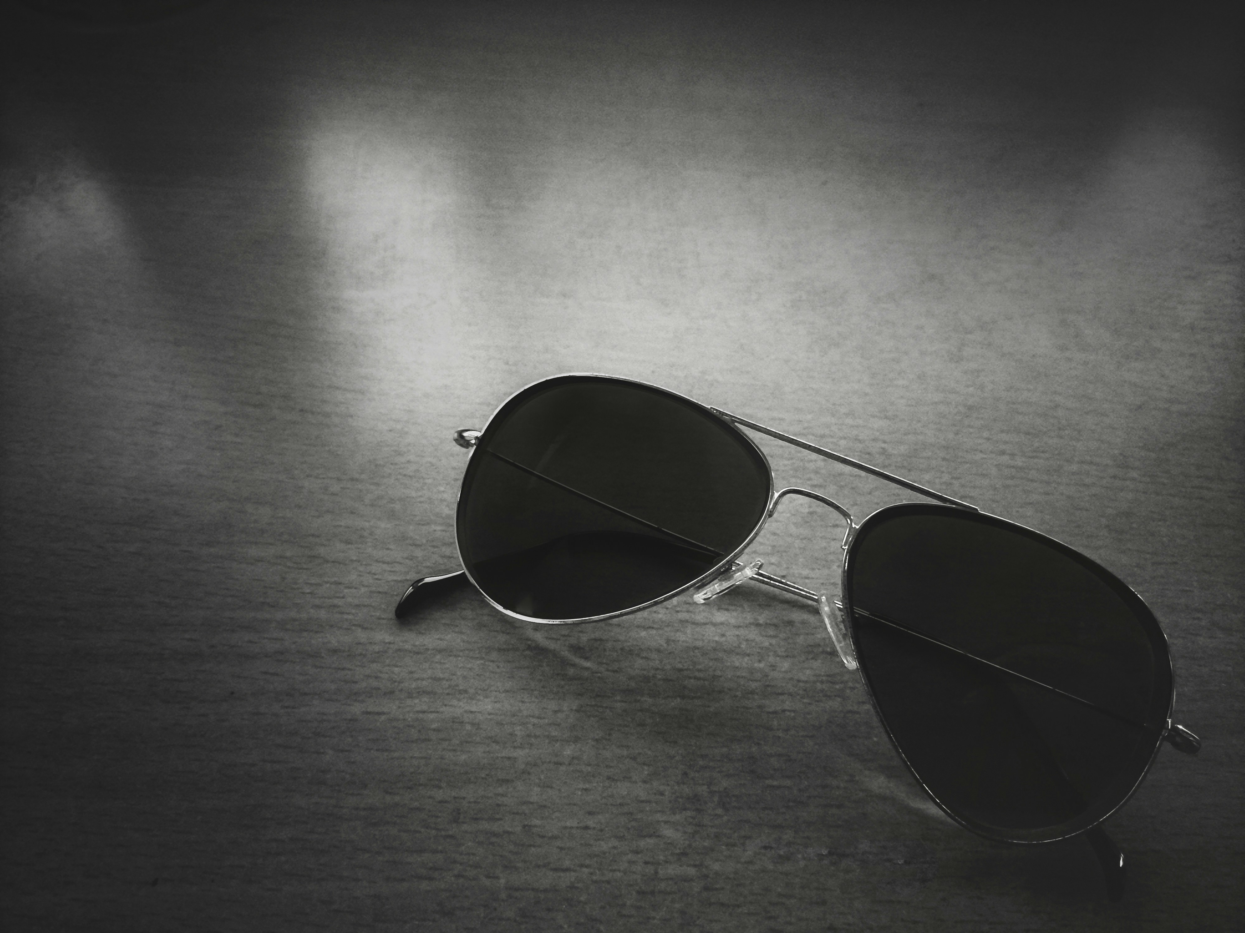 Clubmaster Shades on clean white surface, modern product photography