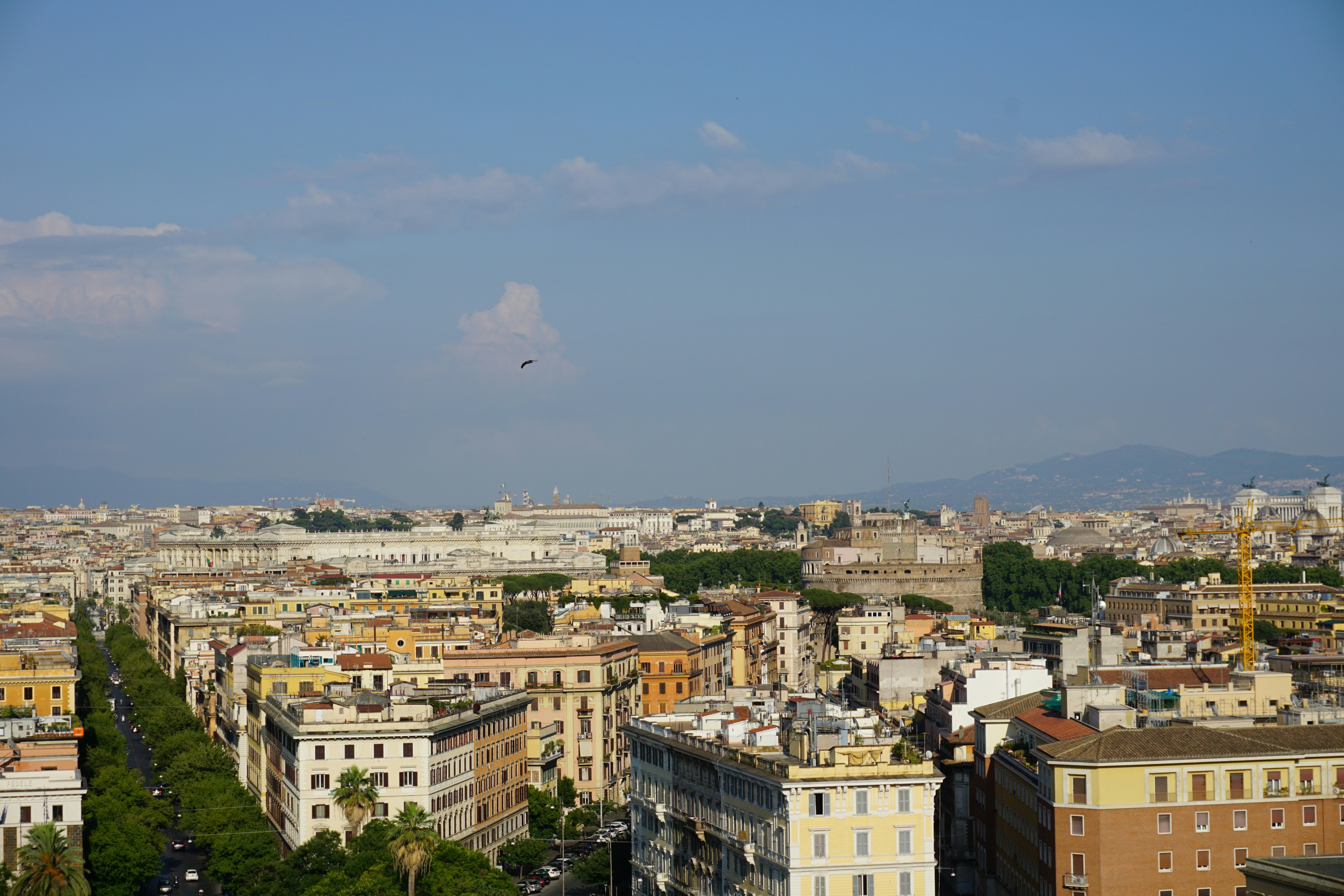 white clouds over city buildings during daytime