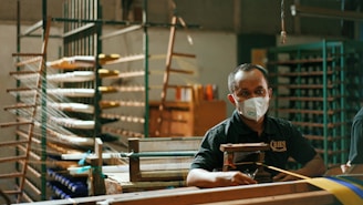 man in black long sleeve shirt wearing white mask