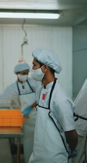 man in white medical scrub wearing white face mask