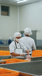 man in white chef uniform holding knife