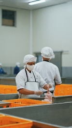 man in white chef uniform holding knife