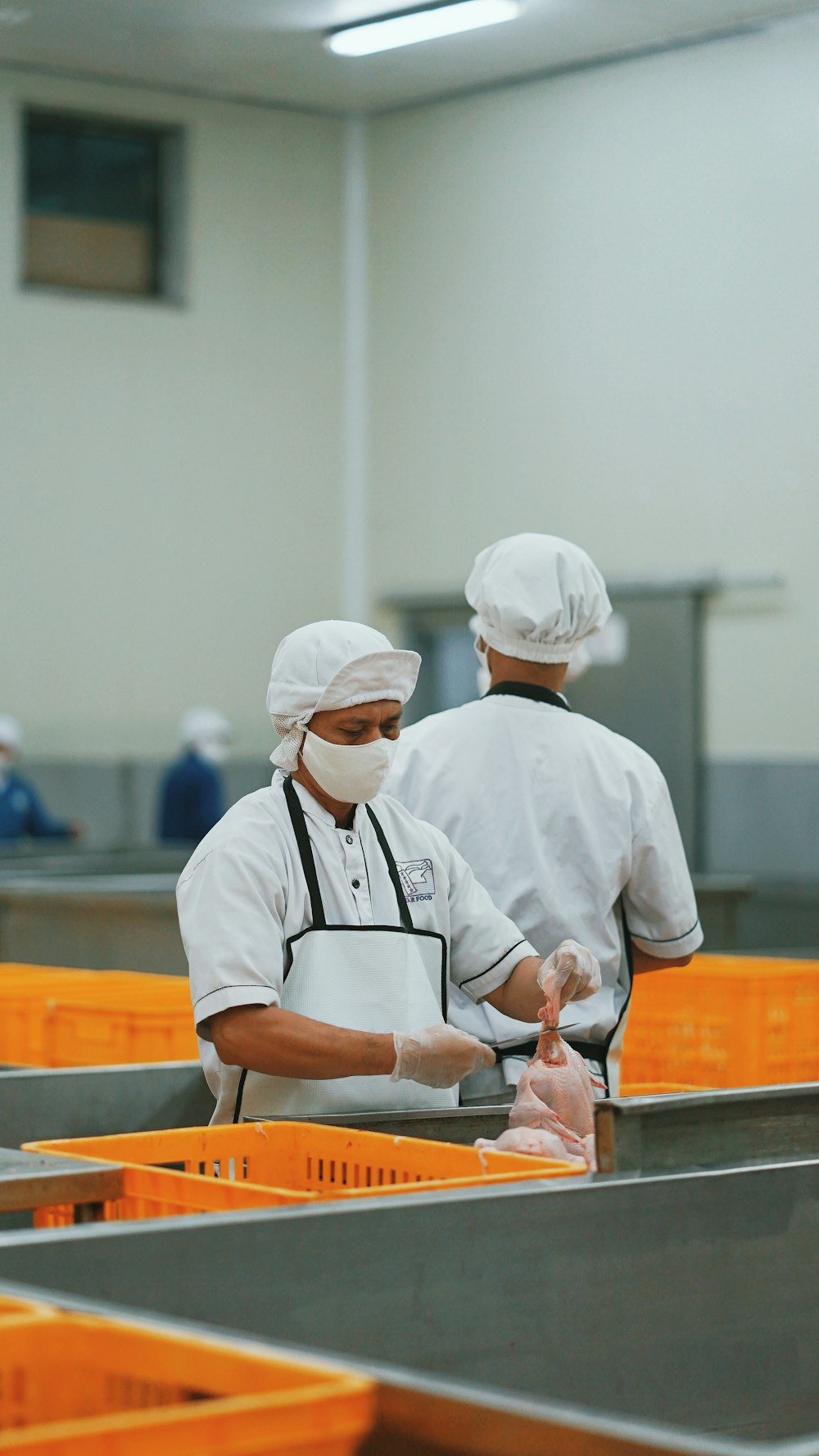 man in white chef uniform holding knife