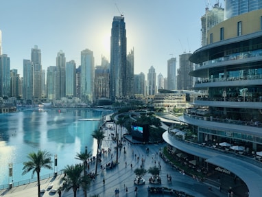 people walking on the street near high rise buildings during daytime