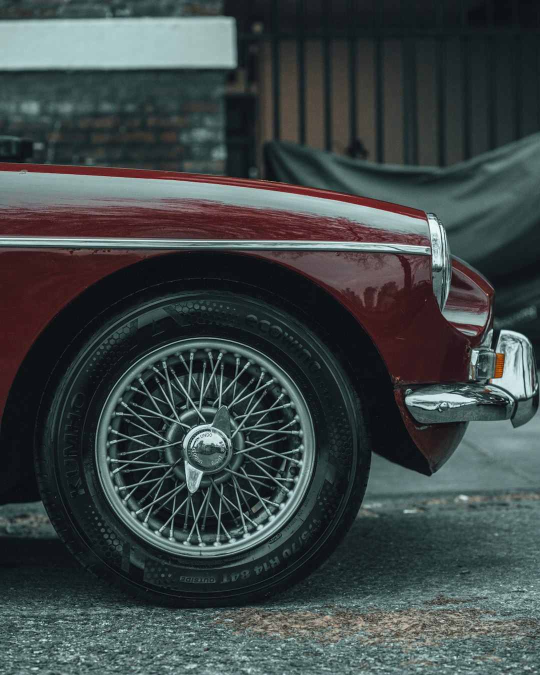 red car with chrome wheel