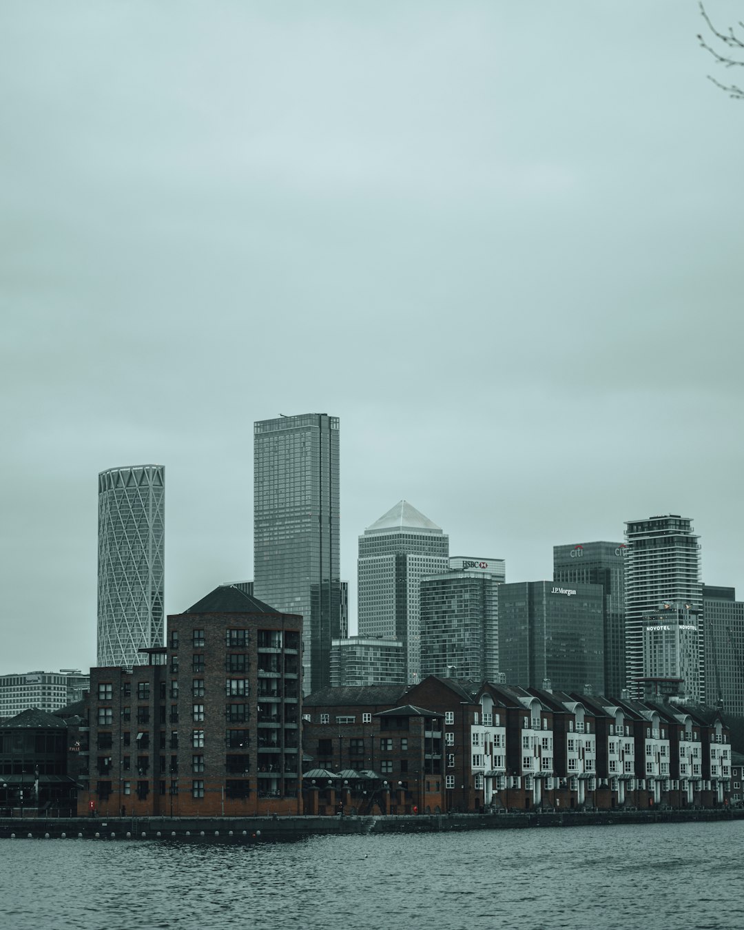 city skyline under gray sky during daytime