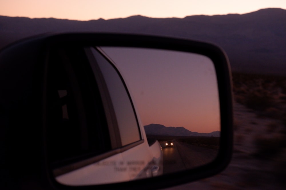 car side mirror showing mountain range