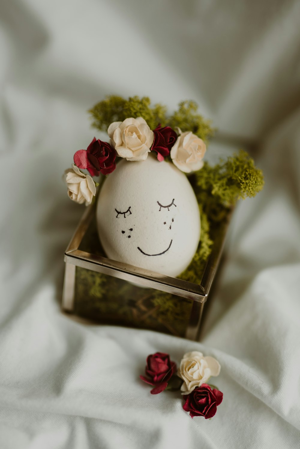 white and pink floral egg ornament