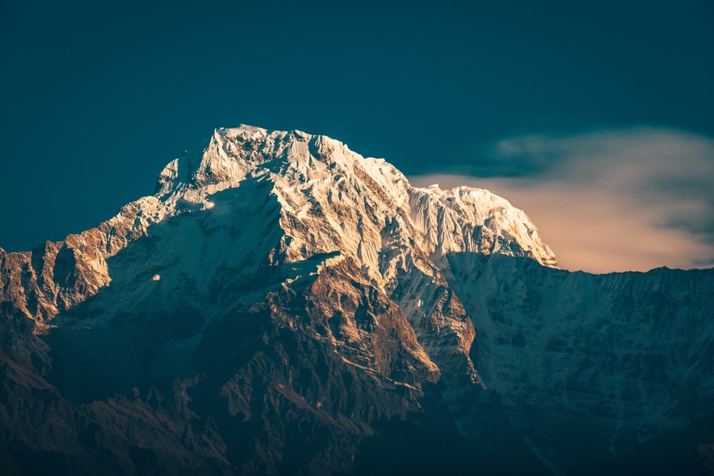 snow covered mountain during daytime