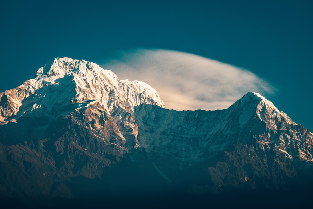 snow covered mountain under blue sky during daytime