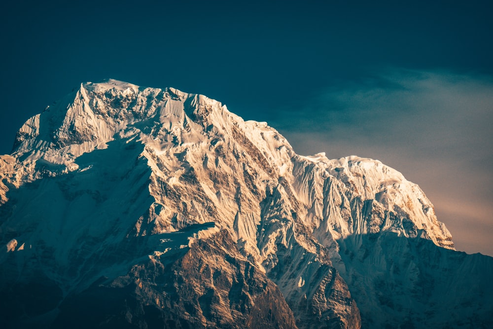 snow covered mountain during daytime