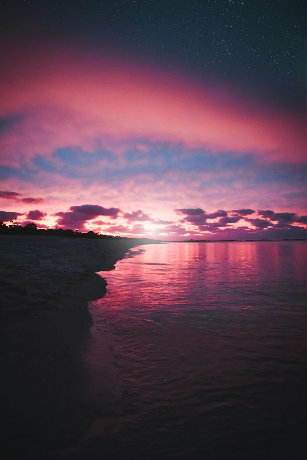 body of water during sunset