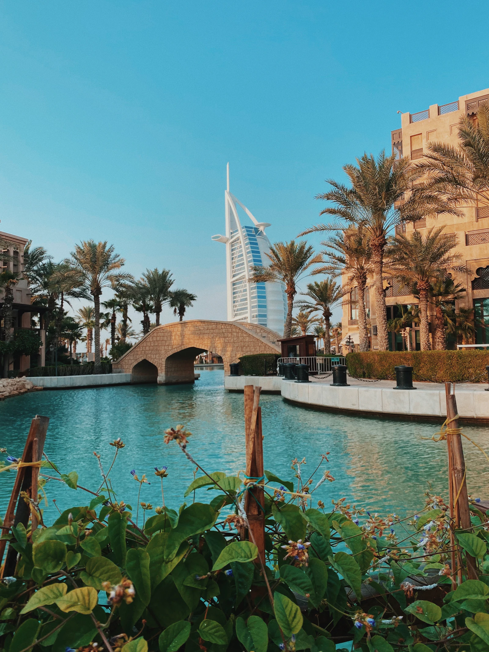Outdoor swimming pool at a mid-range Dubai hotel with city buildings behind