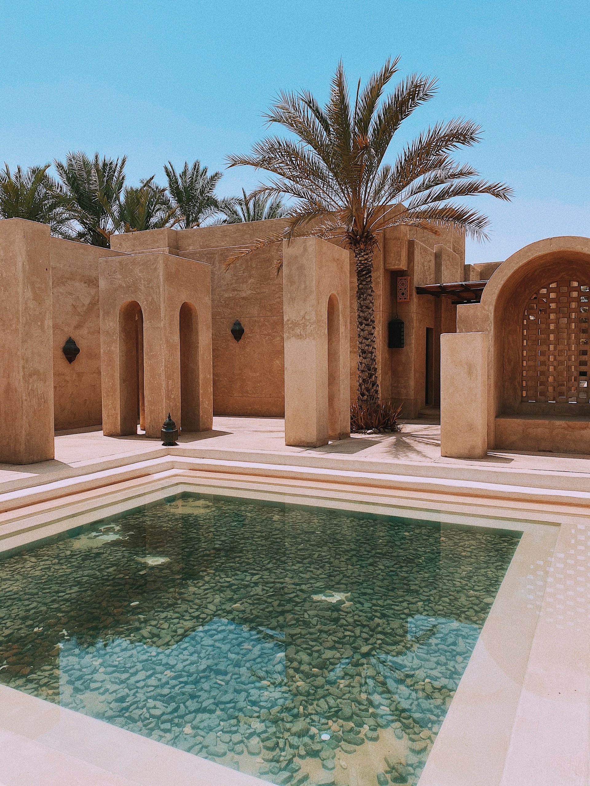 An inviting private pool at Casa Cenote, showcasing the elegant design and natural materials.