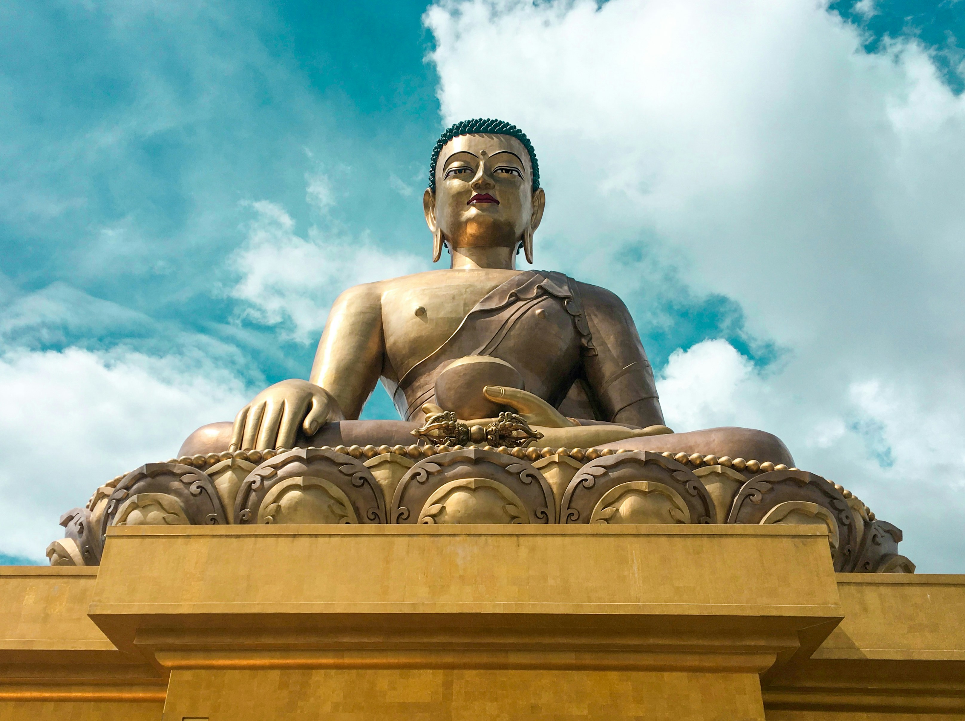 gold statue under blue sky during daytime, Statue of buddha....