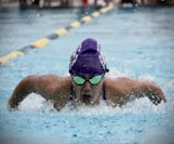 person in swimming goggles in water