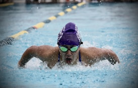 person in swimming goggles in water