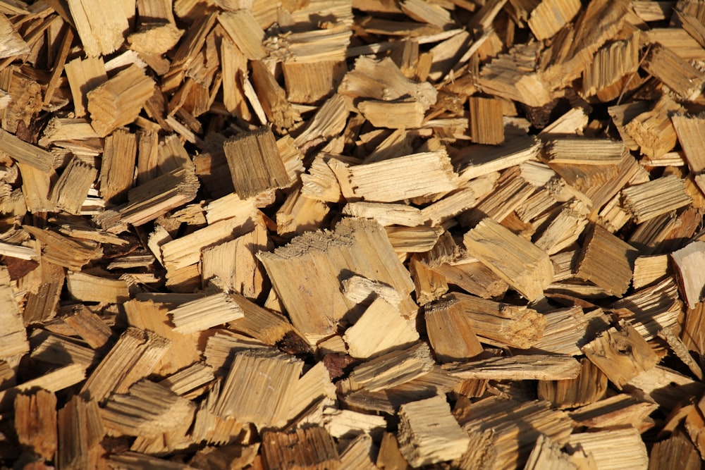 brown wood logs in close up photography