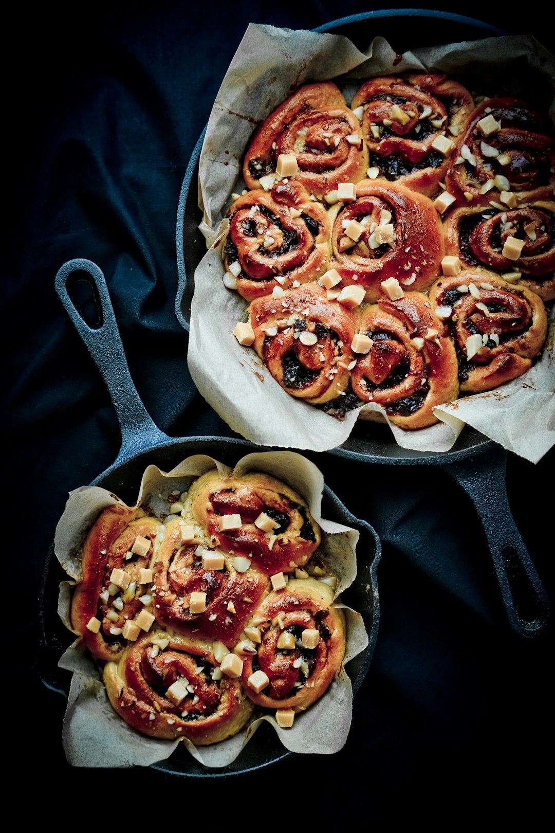 brown and red pizza on black pan