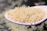 Close-up of a steaming bowl of fluffy Sona Masuri rice with a wooden spoon.