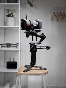 black camera on brown wooden seat