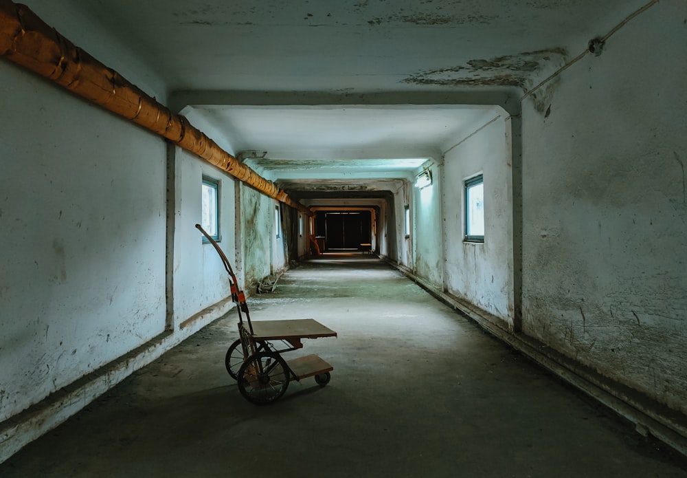 black and red bicycle on hallway