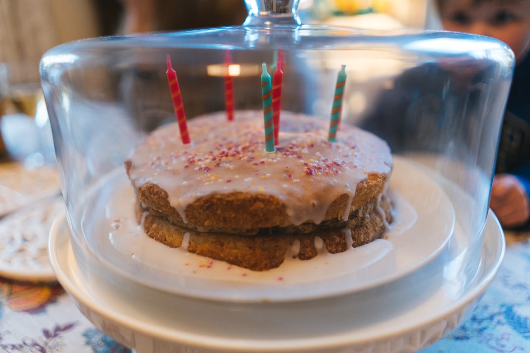 chocolate cake with white icing on white ceramic plate