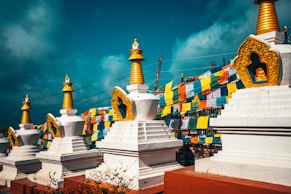 white and gold temple under blue sky