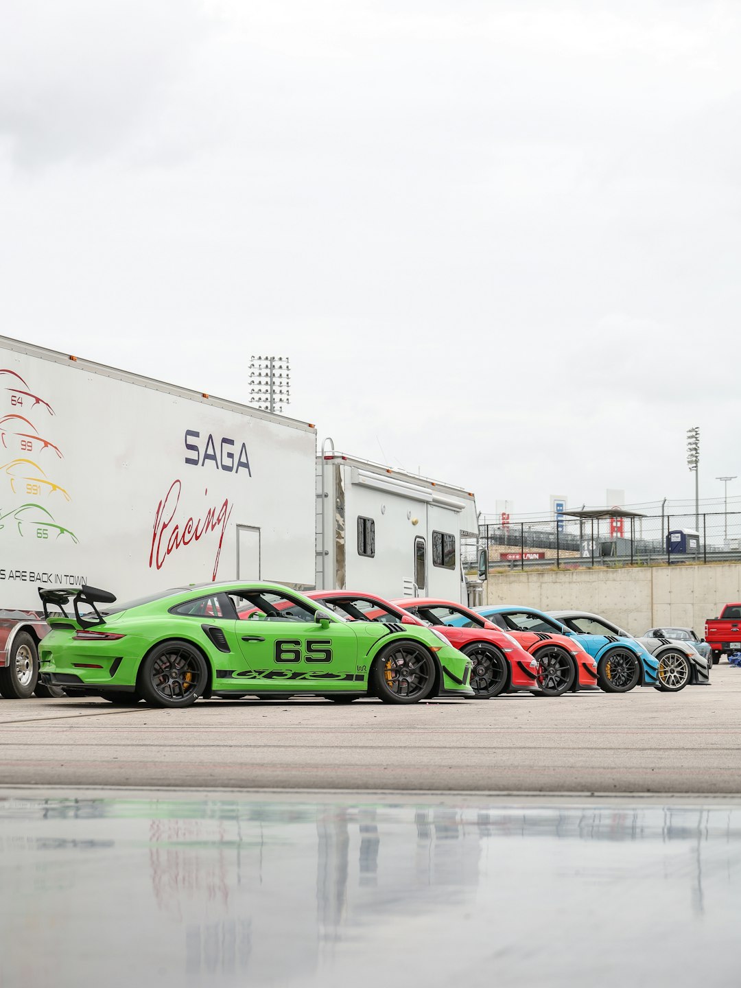 green and black sports car on road during daytime