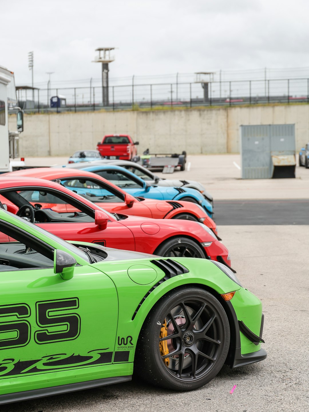 green and black sports car on road during daytime